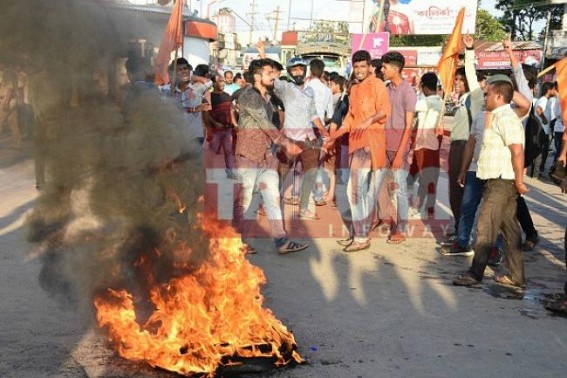 ABVP burns tires protesting SFI's attack upon ABVP members 
